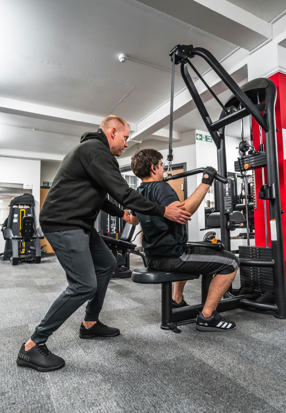 Coach guiding a client through a comfortable one-on-one session.