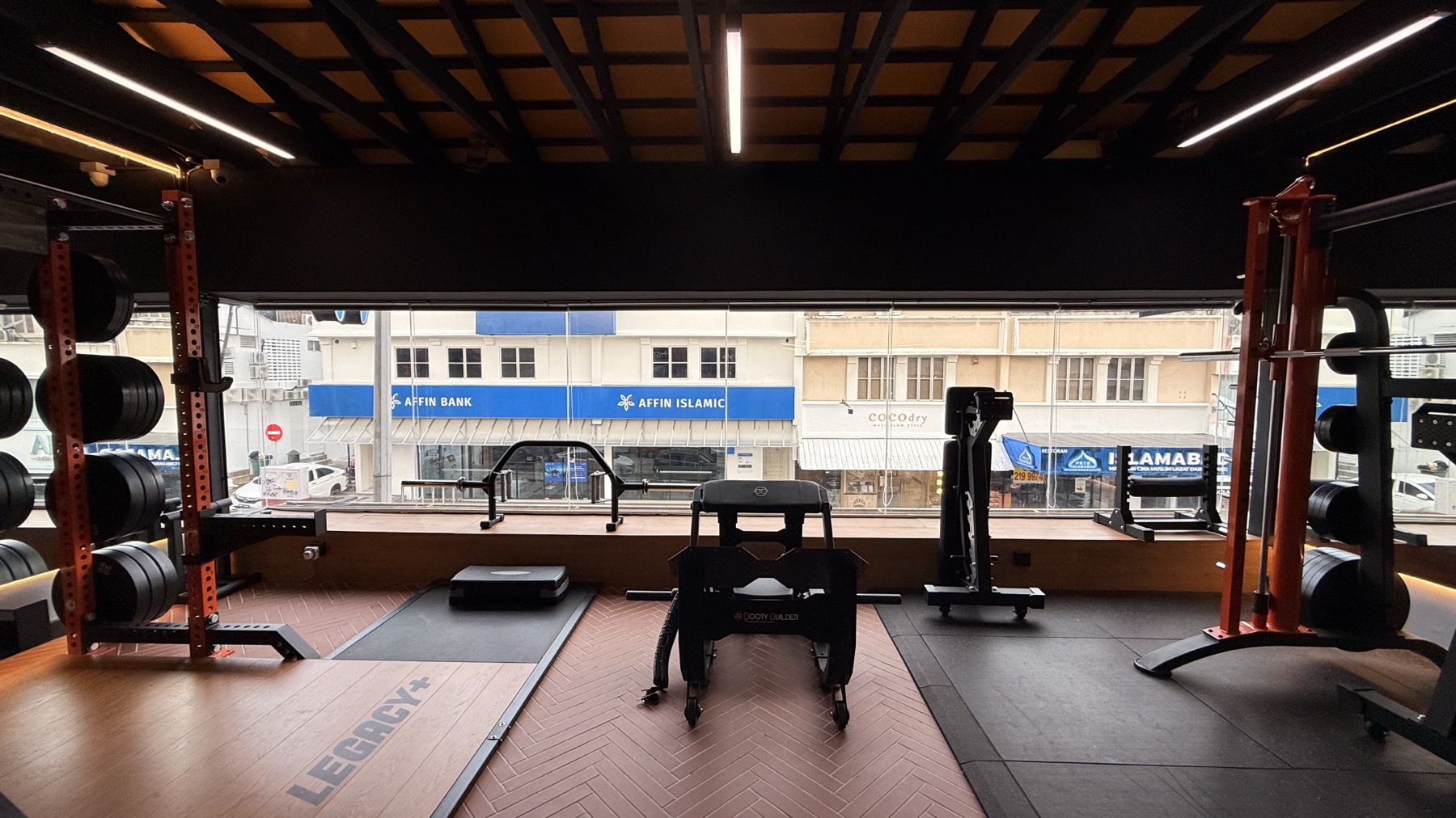 Coaching floor at LEGACY+ with platform, window-side equipment, and open training space.