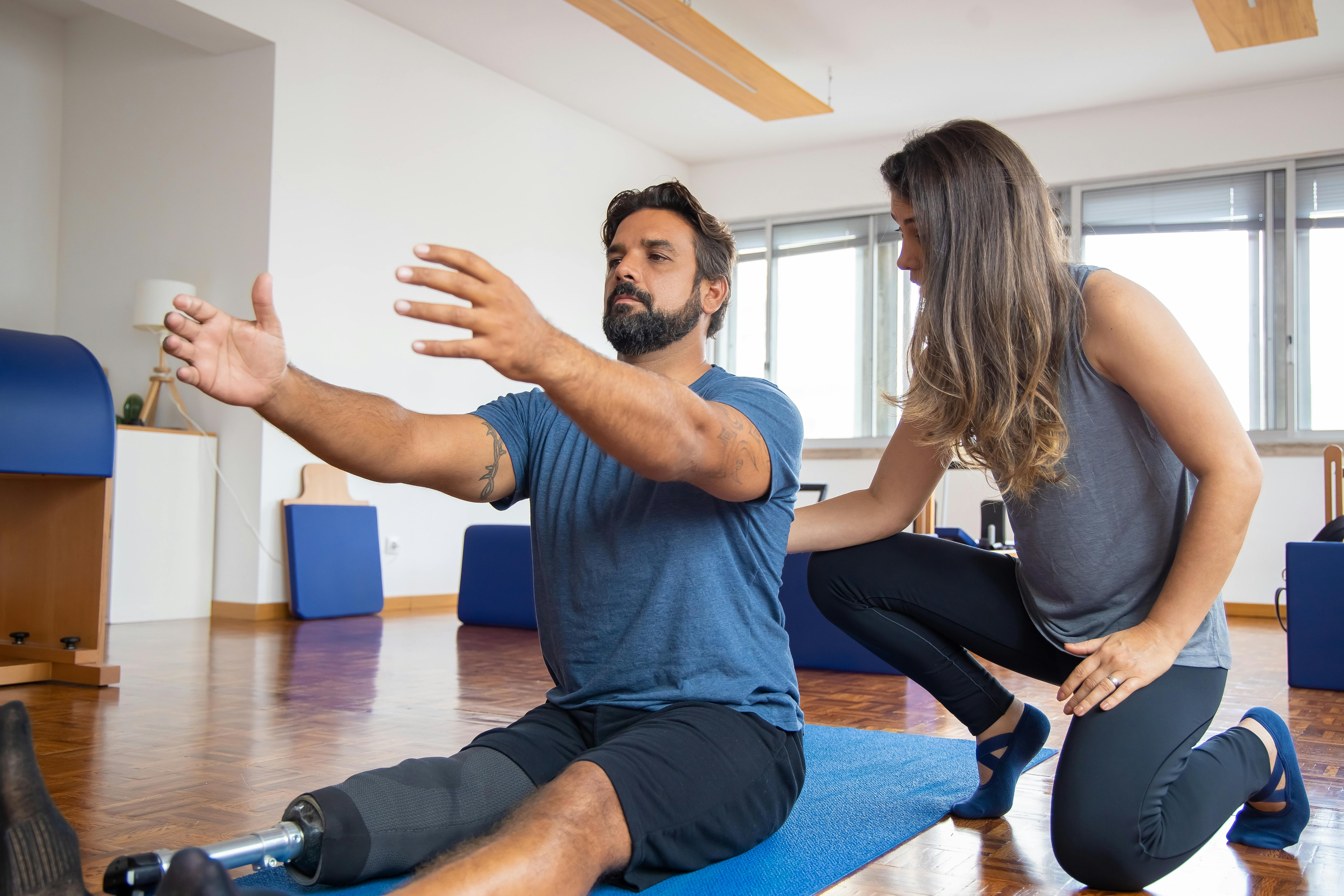 Coach guiding client support and movement quality